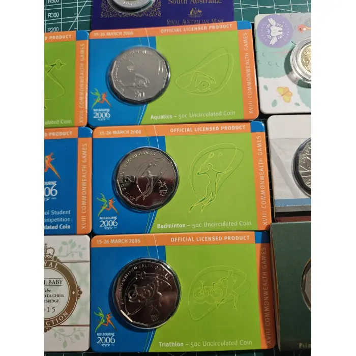 Bundle of wallet sized carded coins, 50 cent, $2- $5- commemorative 