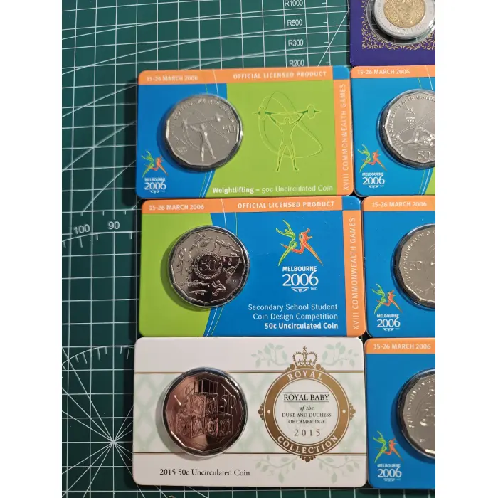 Bundle of wallet sized carded coins, 50 cent, $2- $5- commemorative 