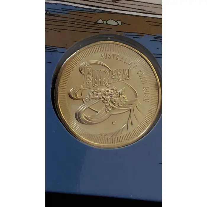 Eureka set up for grabs - $1 unc 'C' mint coin on card