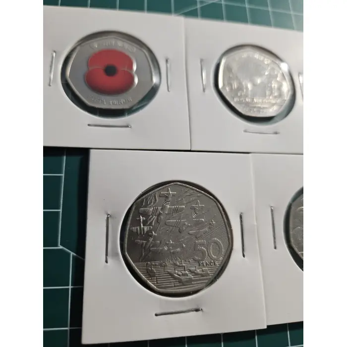 Mixture of British 50 pence, war, remembrance, poppy