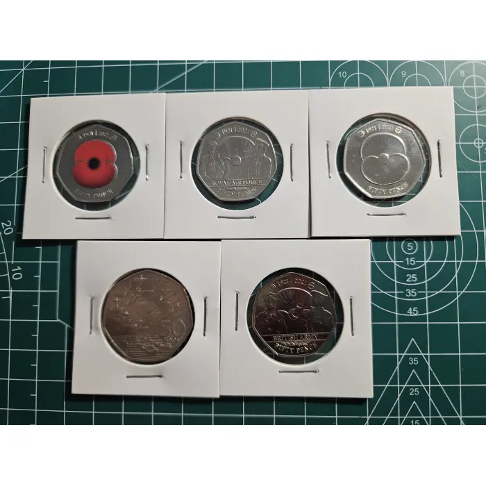 Mixture of British 50 pence, war, remembrance, poppy