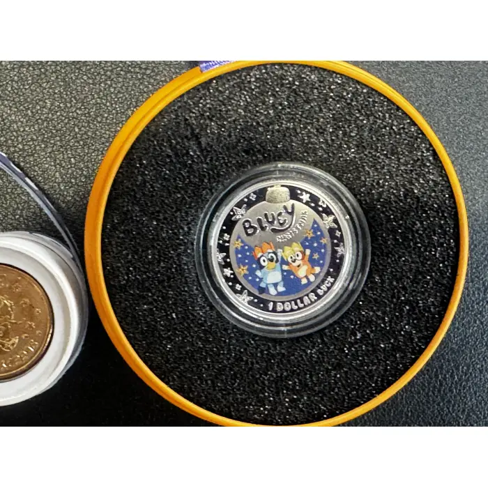 2025 $1 bluey christmas silver proof coin and 2026 $2 Coin Roll and folder Opene